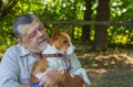 Portrait of a bearded senior man with his basenji dog Royalty Free Stock Photo
