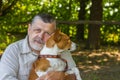 Portrait of a bearded senior man with his cute dog Royalty Free Stock Photo