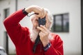 Portrait of bearded senior man photographer with old camera taking photo Royalty Free Stock Photo