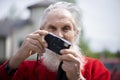 Portrait of bearded senior man photographer with old camera taking photo Royalty Free Stock Photo