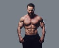 Portrait of bearded shirtless bodybuilder.