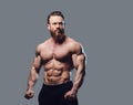 Portrait of bearded shirtless bodybuilder.