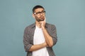 Portrait of thoughtful handsome man with black glasses in casual Royalty Free Stock Photo
