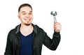 Portrait of bearded young man holding adjustable wrench. isolated on white background Royalty Free Stock Photo