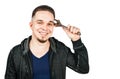 Portrait of bearded young man holding adjustable wrench. isolated on white background Royalty Free Stock Photo