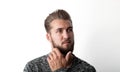 Portrait of a bearded, young and thoughtful man isolated on a white background Royalty Free Stock Photo