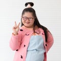 Portrait of beaufiful and cute teen Asian down syndrome girl posing as a model with fun and delight self-confidence Royalty Free Stock Photo