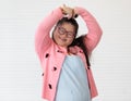 Portrait of beaufiful and cute teen Asian down syndrome girl posing as a model with fun and delight self-confidence Royalty Free Stock Photo