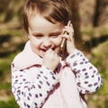 Portrait of beautifu and very happy little child girl talking on Royalty Free Stock Photo