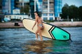 Portrait of beautiful active woman spending summer holidays on the beach, enjoying surfing, Bali, Indonesia Royalty Free Stock Photo