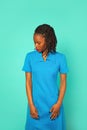 portrait of a beautiful African American girl. dread braid hairstyle. turquoise background.