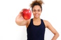 Beautiful african american girl holding apple against white background Royalty Free Stock Photo