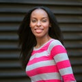 portrait of beautiful african american smiling young adult woman Royalty Free Stock Photo