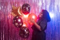 Portrait of a beautiful african american woman against twinkling background. Birthday party, nightclub and nightlife Royalty Free Stock Photo