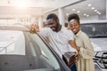 Portrait of beautiful african couple in dealership Royalty Free Stock Photo