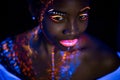 Portrait of beautiful african fashion model in neon UF light Royalty Free Stock Photo
