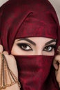 Portrait of beautiful arabian girl hiding her face