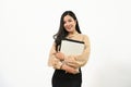 Portrait of beautiful asian business woman holding folder standing isolated over white background Royalty Free Stock Photo