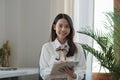 Portrait of beautiful asian businesswoman looking on camera while working with paperwork at modern office. Royalty Free Stock Photo