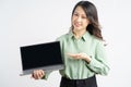 Portrait of the beautiful asian businesswoman looking at the laptop screen with a surprised look Royalty Free Stock Photo