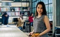 Portrait of beautiful Asian businesswoman wearing casual clothes for working, smiling with happiness, confidence, success, sitting Royalty Free Stock Photo