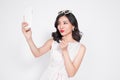 Portrait of beautiful asian fashionable girl taking selfie Royalty Free Stock Photo