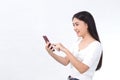 Portrait of beautiful asian girl Use the smartphone happily on a white background Royalty Free Stock Photo