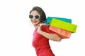 Portrait of beautiful asian girl wearing dress and sunglasses holding shopping bags isolated over blue background Royalty Free Stock Photo