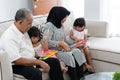 Grandparent with their granddaughters playing together Royalty Free Stock Photo