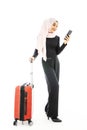 Portrait of beautiful asian muslim tourist traveller woman in a hijab holding red suitcase luggage get ready for traveling and