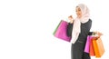 Portrait of beautiful asian muslim woman in a black hijab holding multi-colored shopping bags in her hand religion Islam shopping Royalty Free Stock Photo