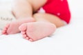 Newborn little baby sleeping on white bed at home