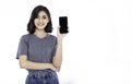 Portrait of beautiful Asian successful business girl celebrate with smartphone. Royalty Free Stock Photo