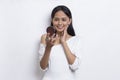 Beautiful asian woman applying powder at makeup of cosmetic isolated on white background Royalty Free Stock Photo