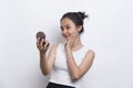 Beautiful asian woman applying powder at makeup of cosmetic  on white background Royalty Free Stock Photo