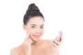 Portrait of beautiful asian woman applying powder puff at cheek makeup of cosmetic, beauty of girl with face smile isolated Royalty Free Stock Photo