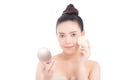 Portrait of beautiful asian woman applying powder puff at cheek makeup of cosmetic, beauty of girl with face smile isolated Royalty Free Stock Photo