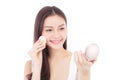 Portrait of beautiful asian woman applying powder puff at cheek makeup of cosmetic. Royalty Free Stock Photo