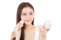 Portrait of beautiful asian woman applying powder puff at cheek makeup of cosmetic. Royalty Free Stock Photo