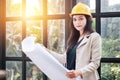 Portrait of beautiful Asian woman architect builder with yellow