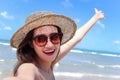 Portrait of beautiful Asian woman with big hat and sunglasses enjoy spending time on tropical sand beach blue sea, happy smiling Royalty Free Stock Photo