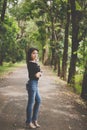 Portrait a beautiful asian woman at forest in the morning