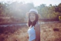 Portrait of beautiful asian woman happy and smiling at nature on during sunset,Relaxation and free time Royalty Free Stock Photo