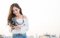 Portrait of beautiful asian woman photographer fashion look taking photo. Royalty Free Stock Photo