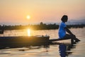 Portrait of beautiful Asian woman sitting on fishing boat, enjo Royalty Free Stock Photo