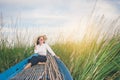 Portrait of beautiful Asian woman sitting on fishing boat, enjo Royalty Free Stock Photo