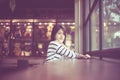 Portrait of beautiful asian woman smiling and looking camera in coffee shop cafe,Happy and fresh with positive thinking,Vintage co