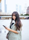 Portrait beautiful asian woman using mobilephone and walking in the city,Female confidence happy and smiling,Lifestyle concept Royalty Free Stock Photo