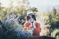 Portrait of beautiful asian woman with flowers at nature,Happy and smiling,Relaxing time,Travel at outdoor Royalty Free Stock Photo