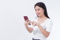 Portrait of beautiful asian women Use the mobile phone happily on a white background Royalty Free Stock Photo